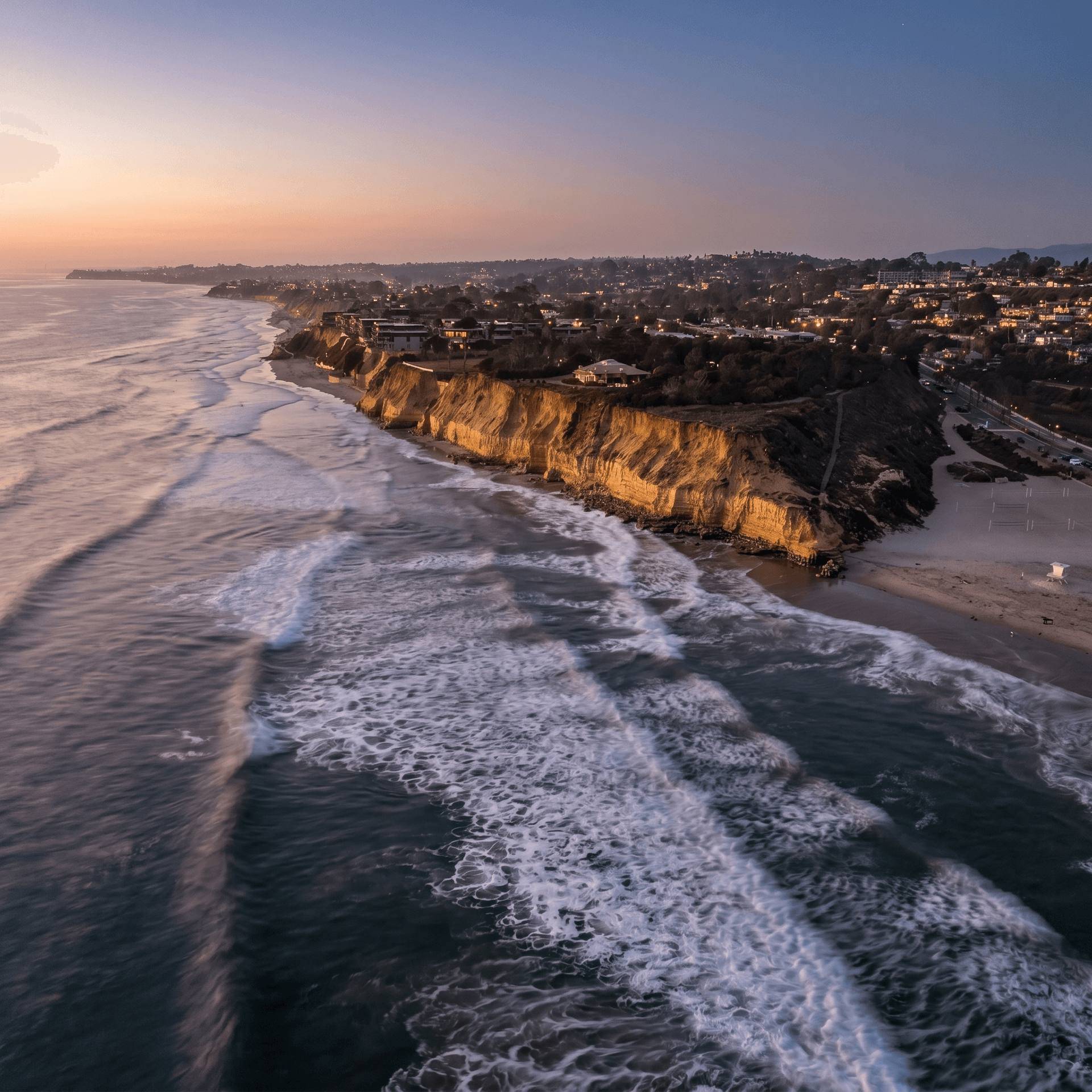 Waves rolling onto a beach at sunset